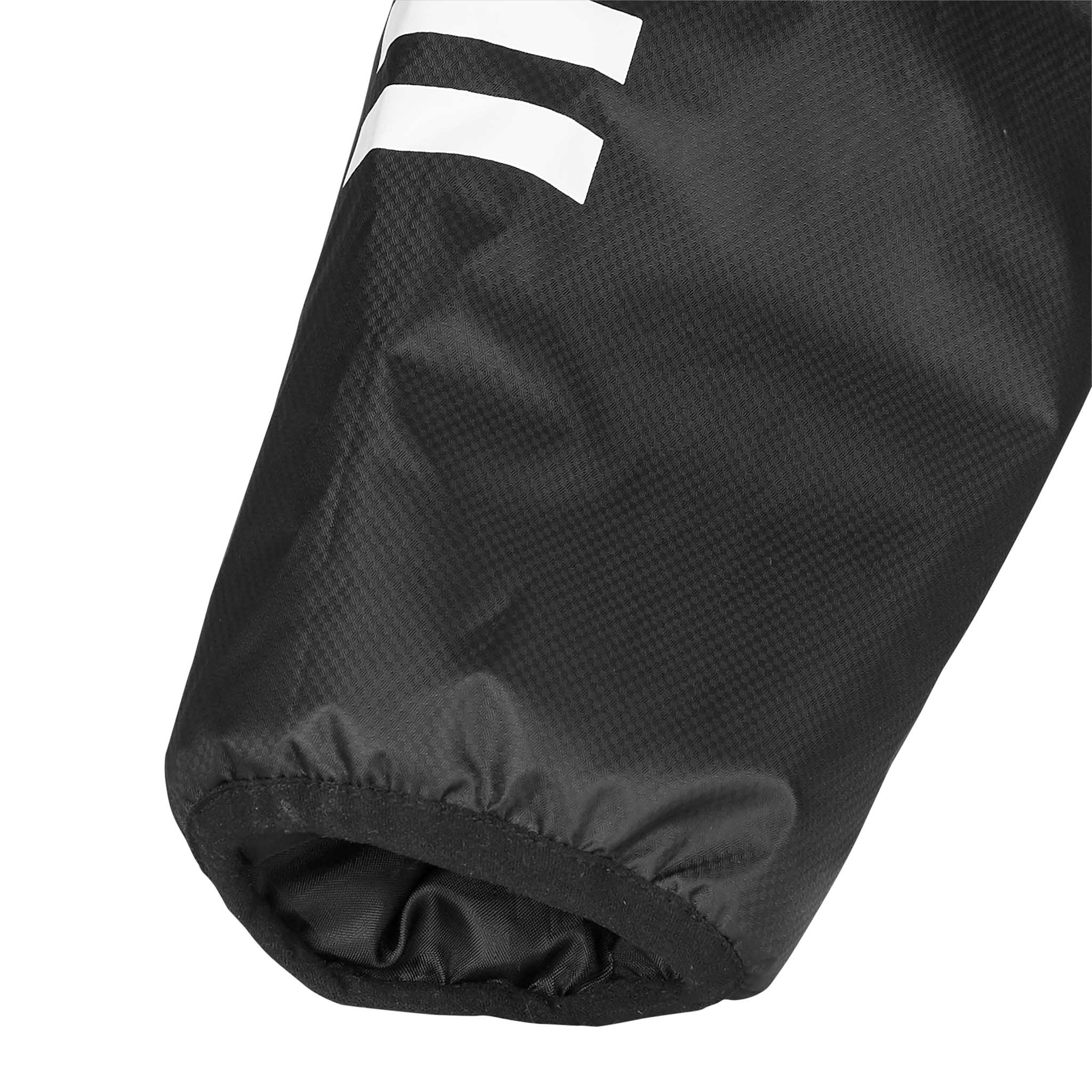 Nærbilde av sort Functional jacket Monaco v24 mansjett med hvite striper, Match & Training wear