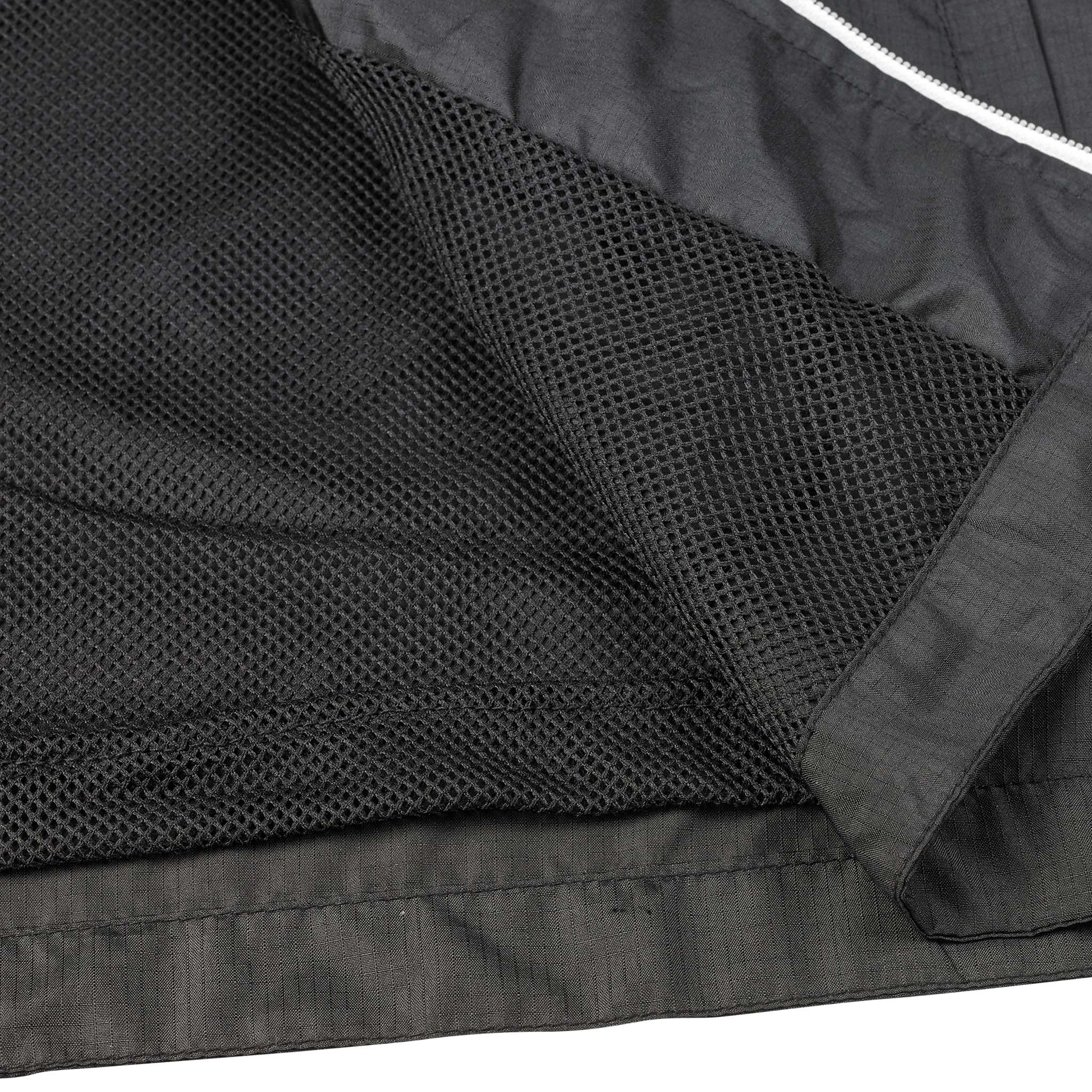 Nærbilde av svart meshfôr og hvit glidelås på Training jacket Spain v25, Match & Training wear for fotball
