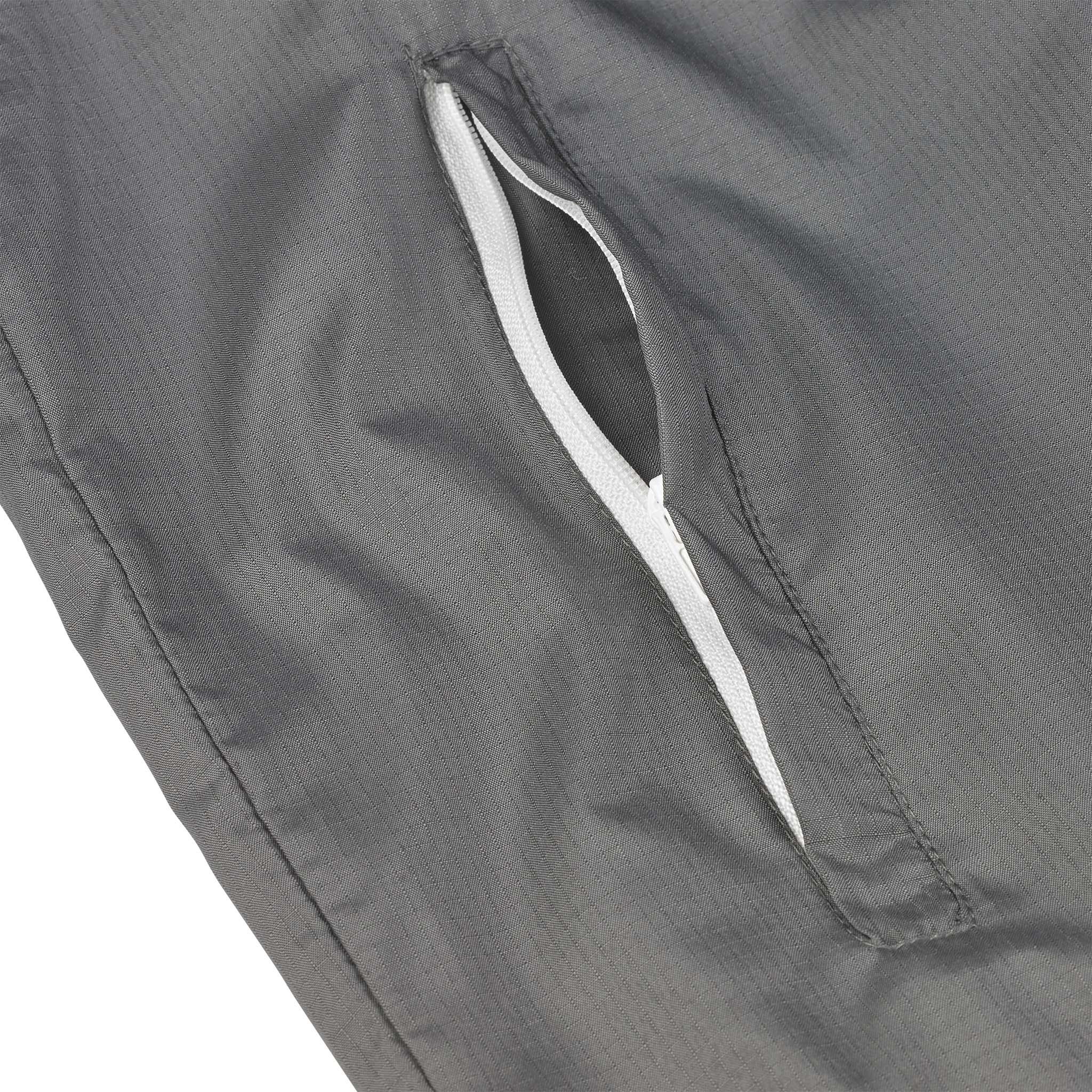 Nærbilde av grå Training jacket Spain v25 lommeglidelås med hvitt fôr, Match & Training wear