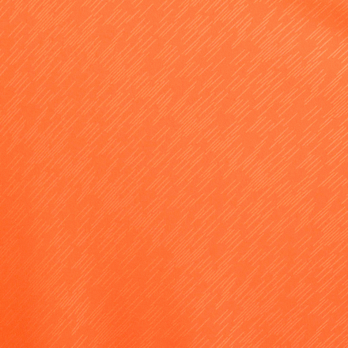 Nærbilde av oransje Player shirt S/S Pisa X, Match & Training wear, viser strukturert fotballdraktstoff.